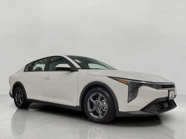 2025 Kia K4 LXS in Snow White Pearl — front three-quarter view